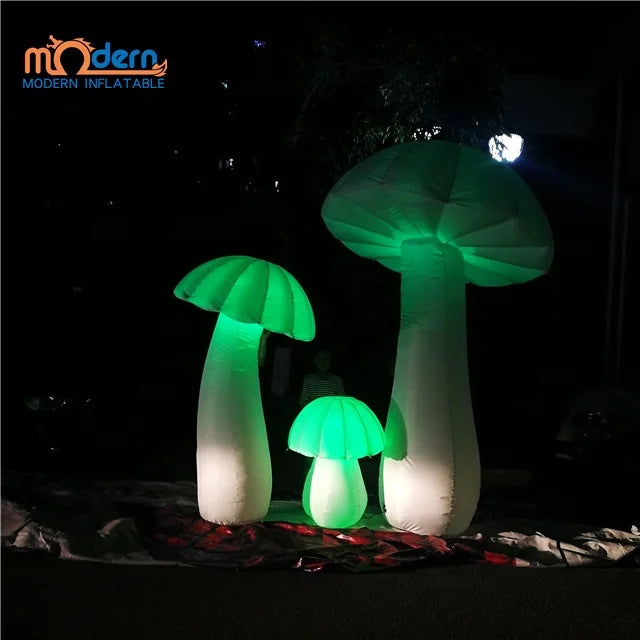 Three illuminated green giant inflatable mushrooms glowing with mushroom balloon rgb lights made of oxford cloth advertising material