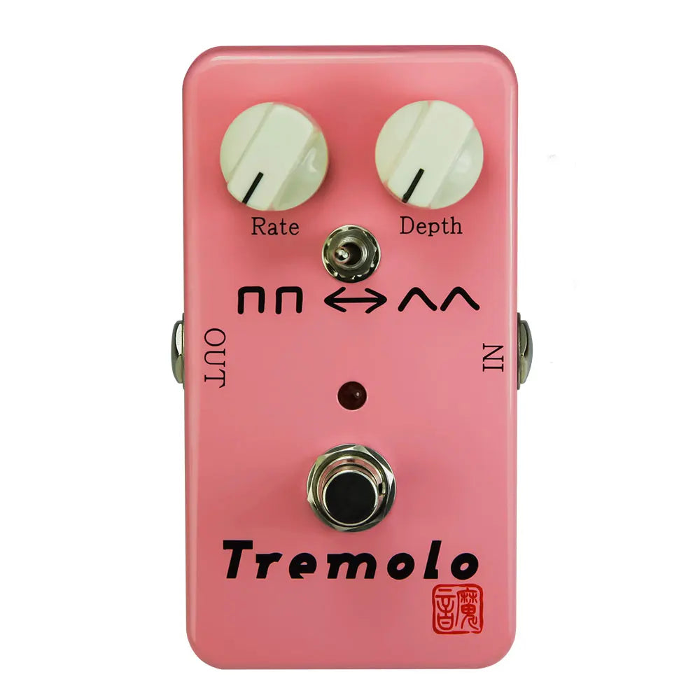 Pink rectangular moen tremolo guitar effects pedal with two white knobs rate and depth 4 monaural jack impedance 140g