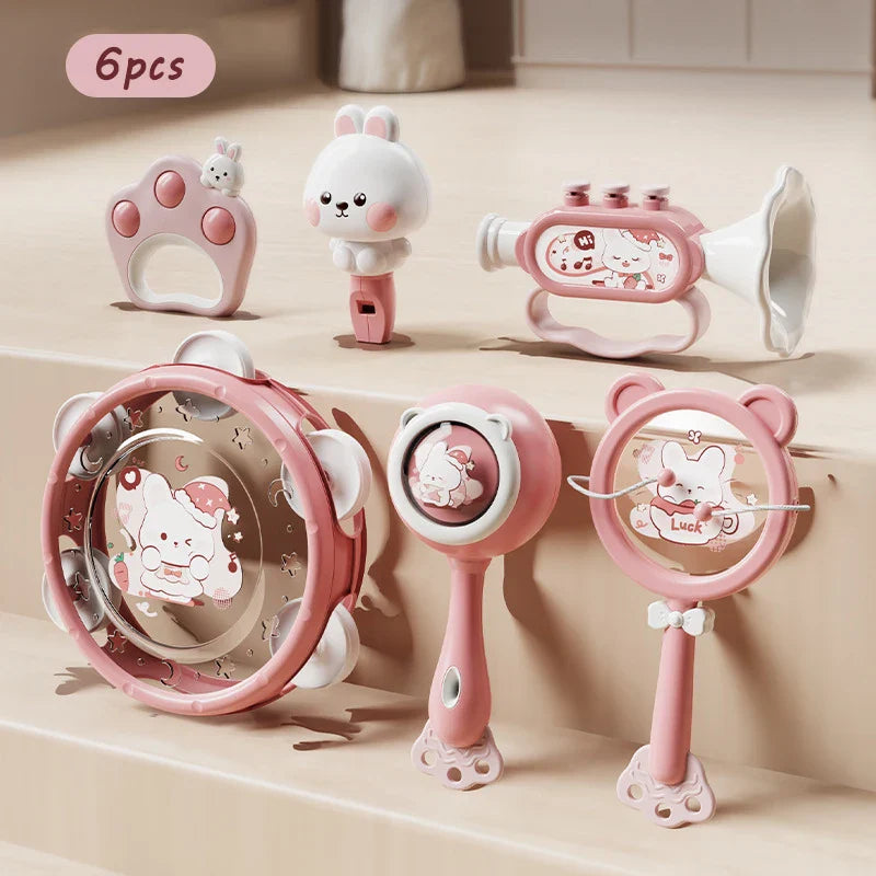 Pink and white montessori music instruments toy baby set featuring dental gum sand hammer hand bell for sensory education