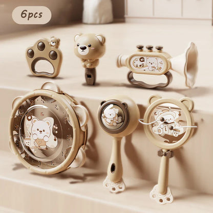 Set of six beige plastic montessori music instruments toy baby featuring bear-themed designs for dental gum sand play