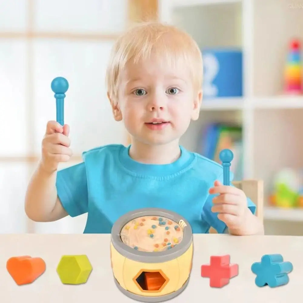 Yellow and gray geometric shape sorting toy with colorful foam pieces in montessori musical drums set percussion for babies