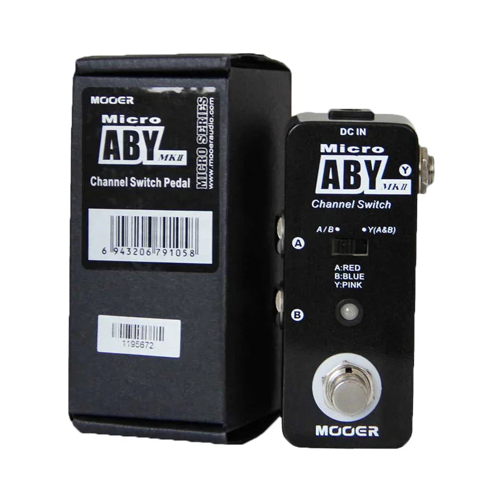 Black mooer aby mkii metal shell channel switch guitar pedal featuring silver footswitch and labeled input output ports