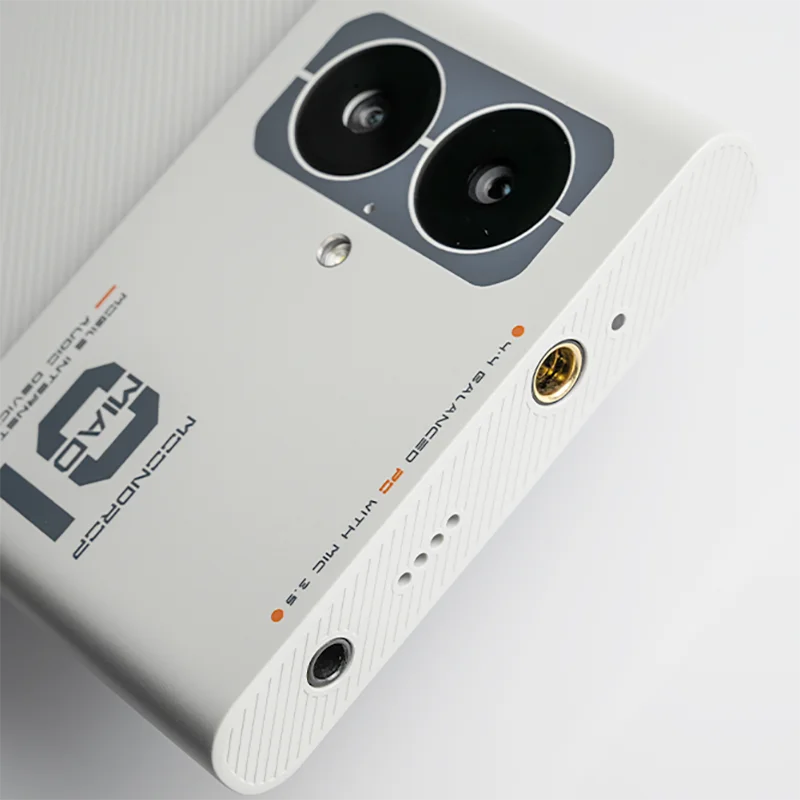 White moondrop miad01 5g mobile audio device music player showing dual black camera lenses and gold-plated headphone jack