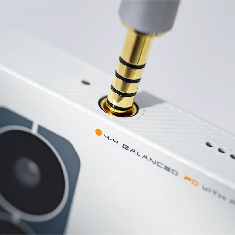 White moondrop miad01 5g mobile audio device music player with gold 4.4mm balanced jack and gray speaker grille design