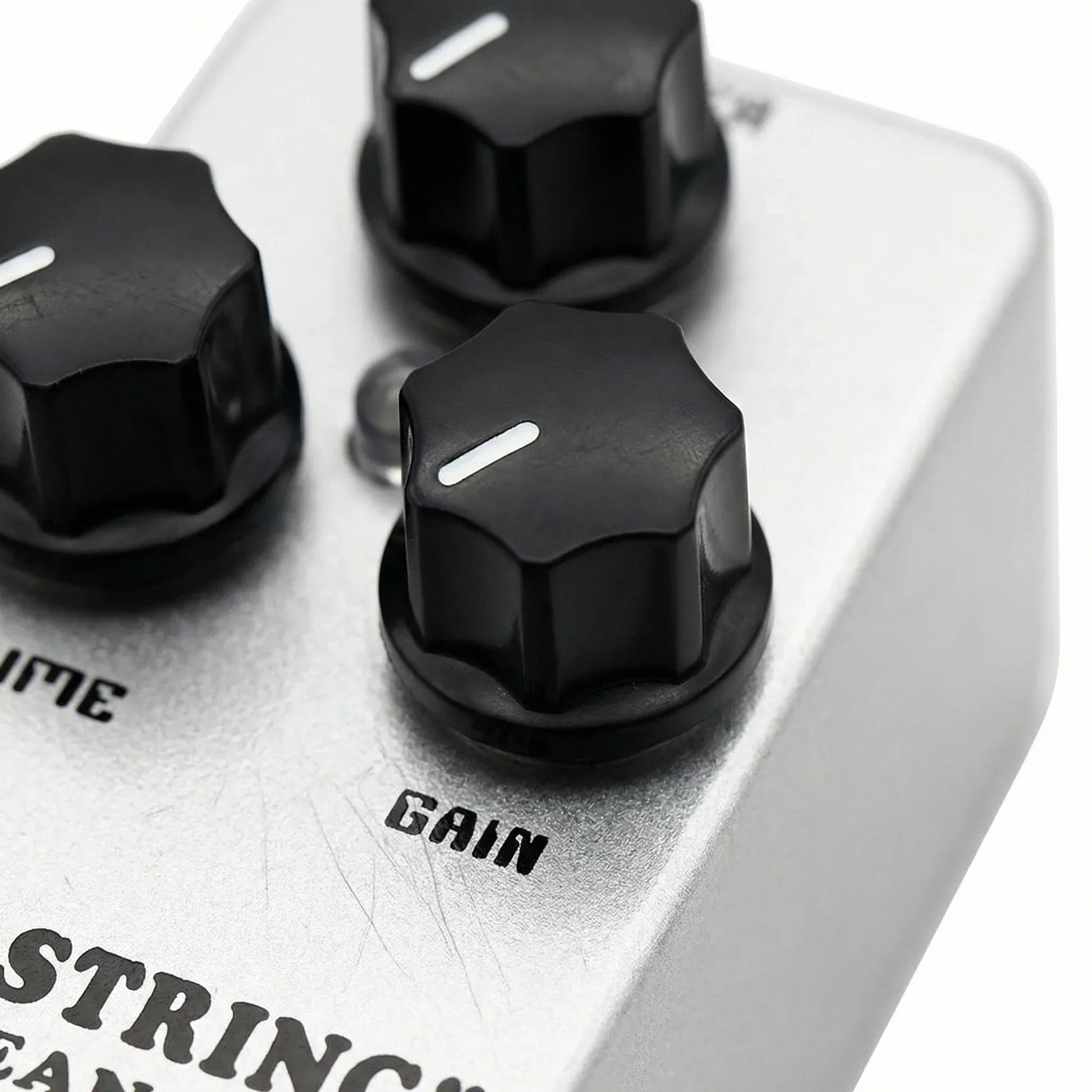 Silver metal mosky electric guitar overdrive pedal with three black hexagonal knobs for clean drive metal tone control