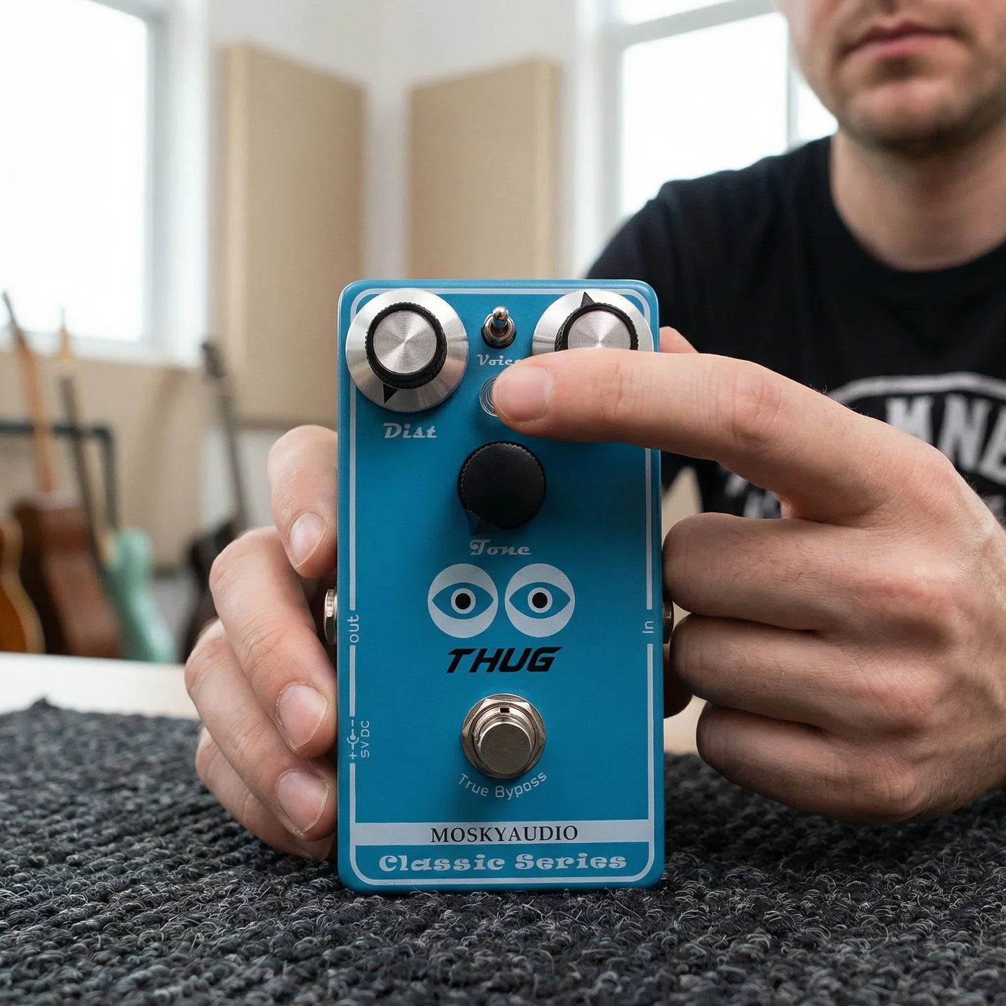 Blue mosky thug distortion guitar pedal with adjustable dist level silver knobs and black footswitch for high gain tones