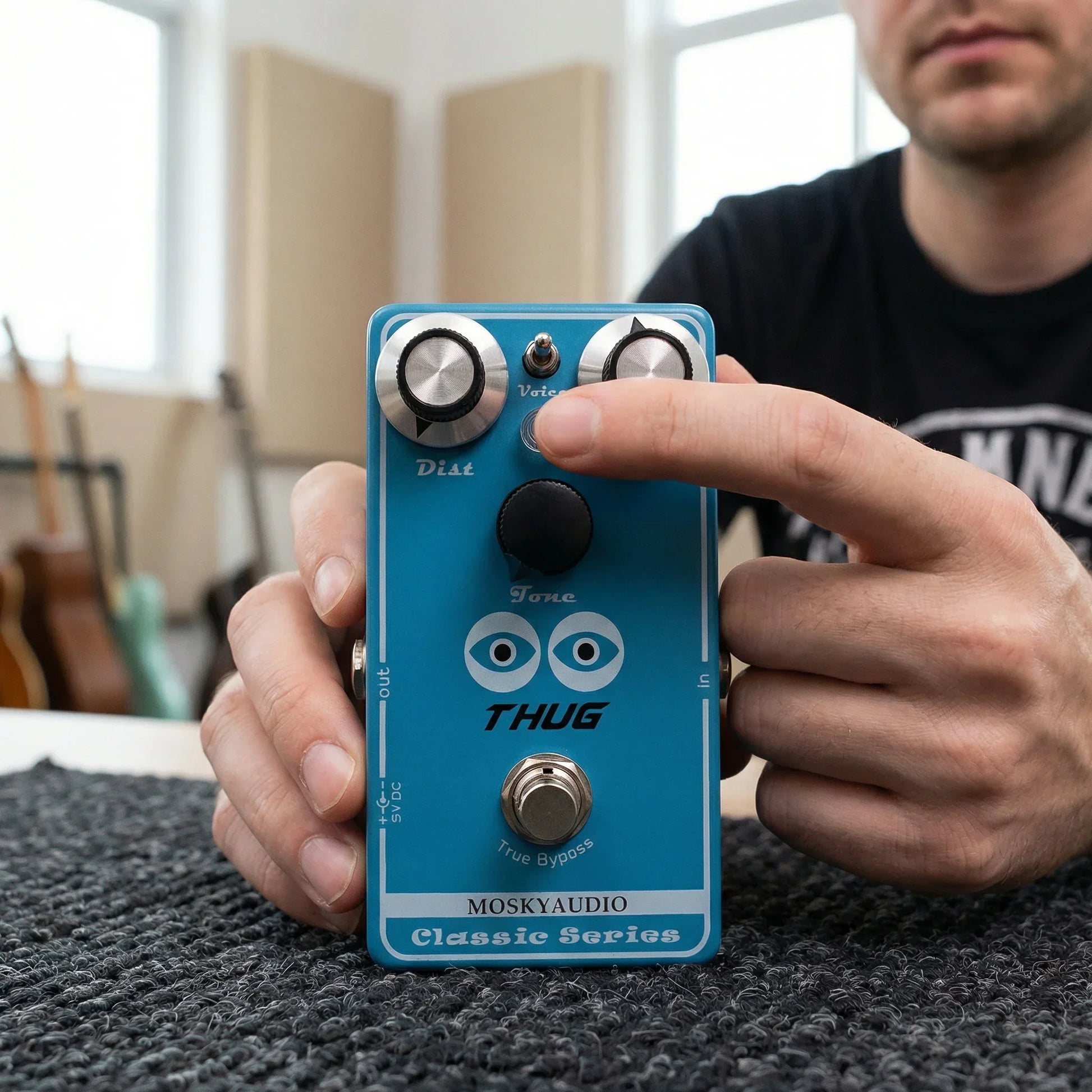 Blue mosky thug distortion guitar pedal with adjustable dist level silver knobs and black footswitch for high gain tones