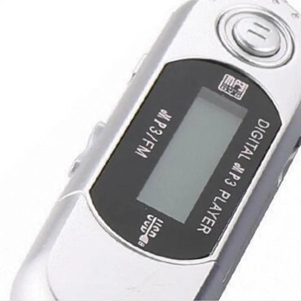 Silver mini mp3 player with black display panel and finger control supports 32g tf card and 3.5mm audio jack