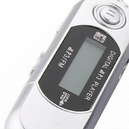 Silver mini mp3 player with black display panel and finger control supports 32g tf card and 3.5mm audio jack