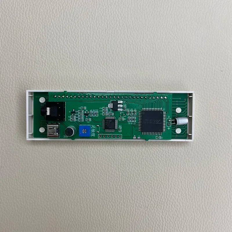 Green circuit board with white casing featuring usb port and components for multi-mode led level indicator audio rhythm lamp