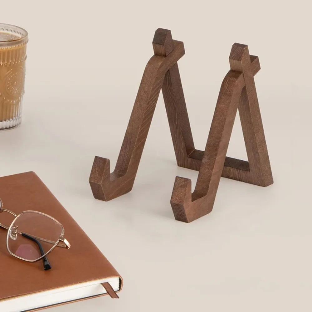 Two dark brown multifunctional retro wooden bookends with angular geometric design for frame stand handmade display