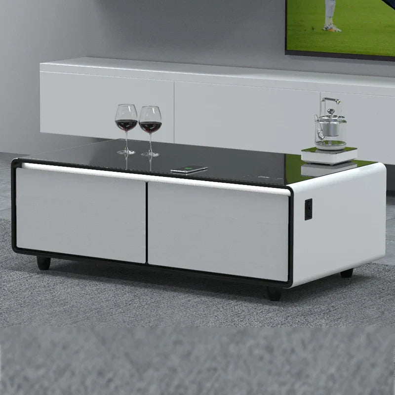 Modern white and black multifunctional smart coffee table with glossy glass top, sleek cabinets, and integrated power ports