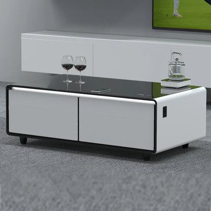Modern white and black multifunctional smart coffee table with glossy glass top, sleek cabinets, and integrated power ports