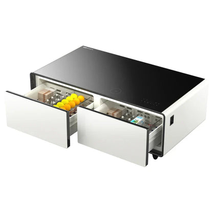 Modern white and black multifunctional smart coffee table with sleek drawers holding oranges bills and electronics for storage