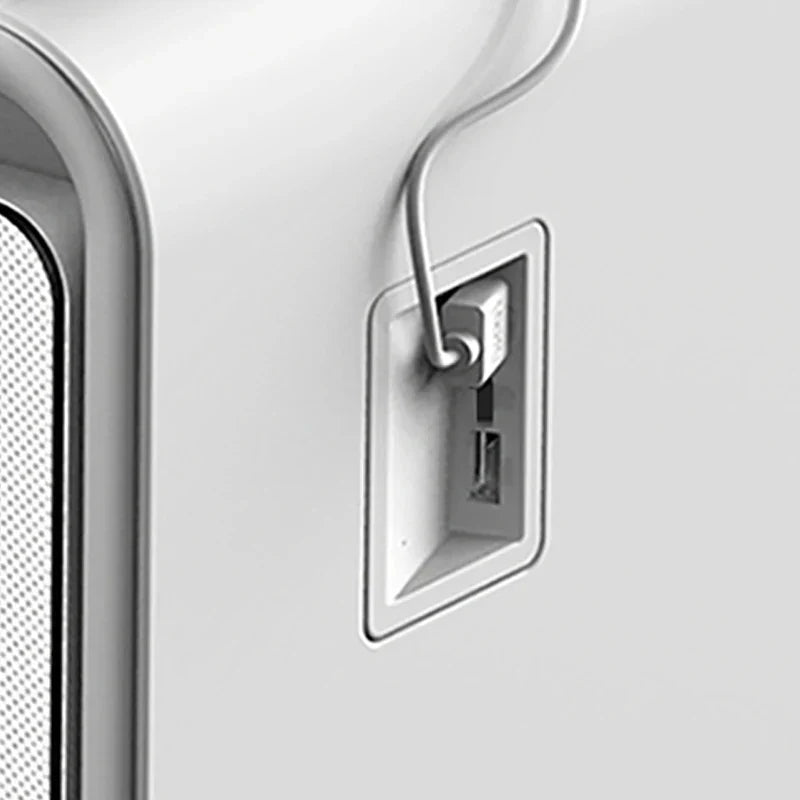 White rectangular usb-c port with integrated cable management on the back of a multifunctional smart coffee table with fridge