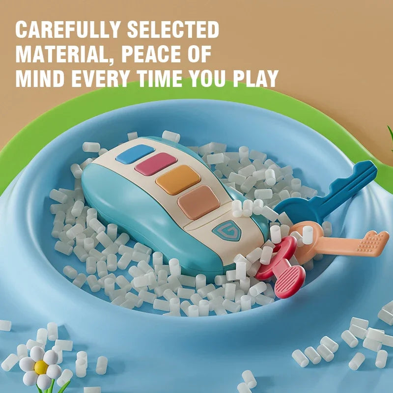 A colorful plastic music car key baby toy with blue, pink, orange buttons in white sensory beads for pretend play simulated use