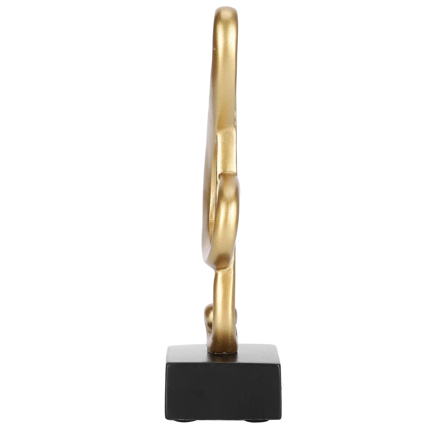 Gold-colored abstract music note statue sculpture home decor made of synthetic resin on a black rectangular base