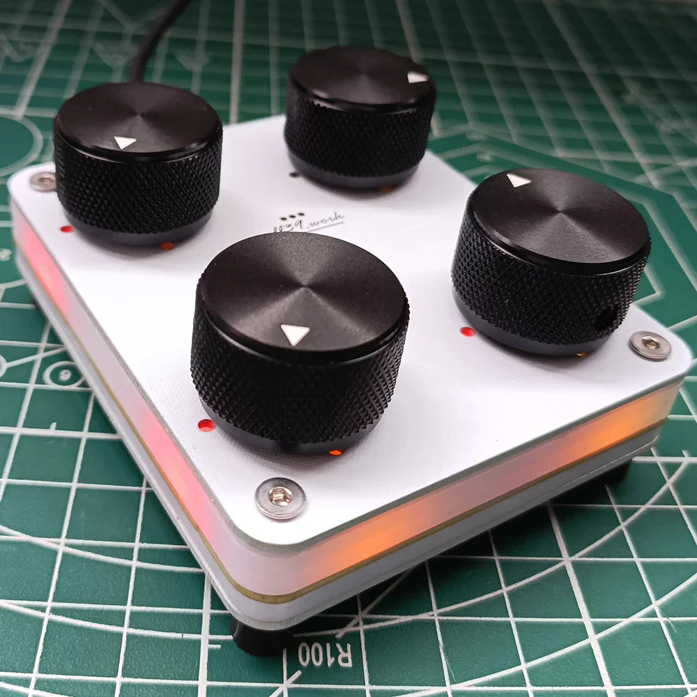 White rectangular audio pedal with four black knurled knobs featuring customizable cc mapping usb-c interface 4-knob midi controller