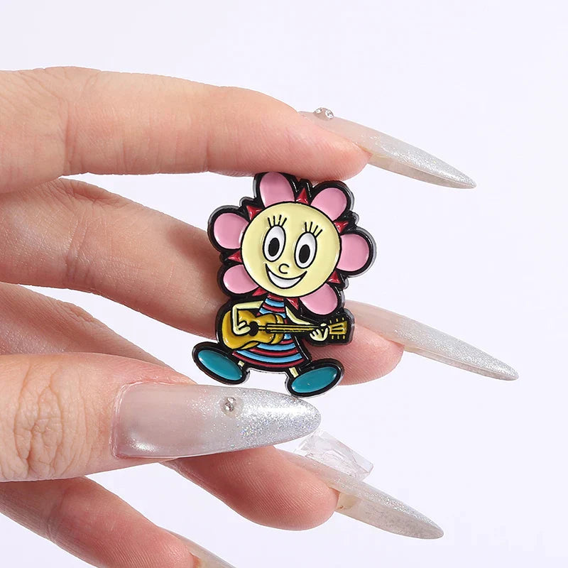 A cheerful yellow flower-shaped enamel lapel badge funny with pink petals holding a guitar from berri game role