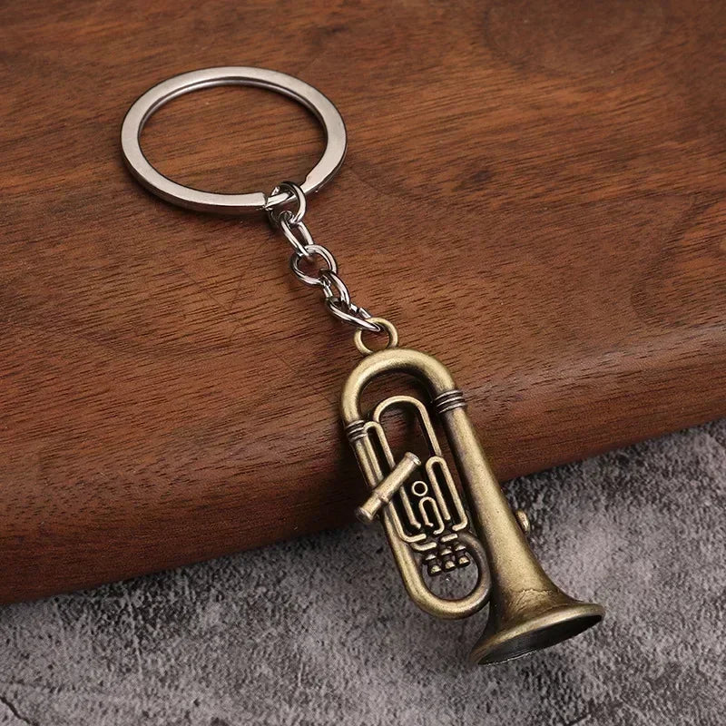 Antique brass-colored tuba-shaped metal keychain with detailed valves and silver ring for small gift men women keyrings mini retro musical instrument