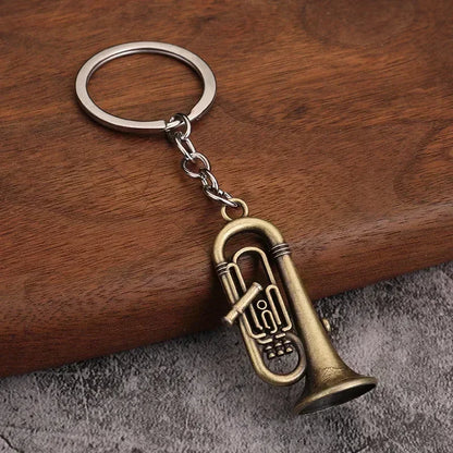 Antique brass-colored tuba-shaped metal keychain with detailed valves and silver ring for small gift men women keyrings mini retro musical instrument