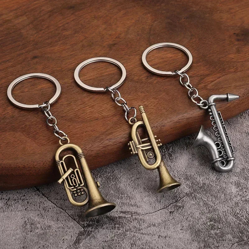 Three metallic keychains with brass and silver retro musical instruments for small gift men and women keyrings mini