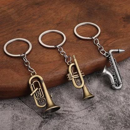 Three metallic keychains with brass and silver retro musical instruments for small gift men and women keyrings mini