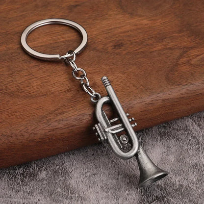 Silver-colored metal trumpet keychain with detailed valves and classic brass finish for small gift men women keyrings mini retro musical instrument