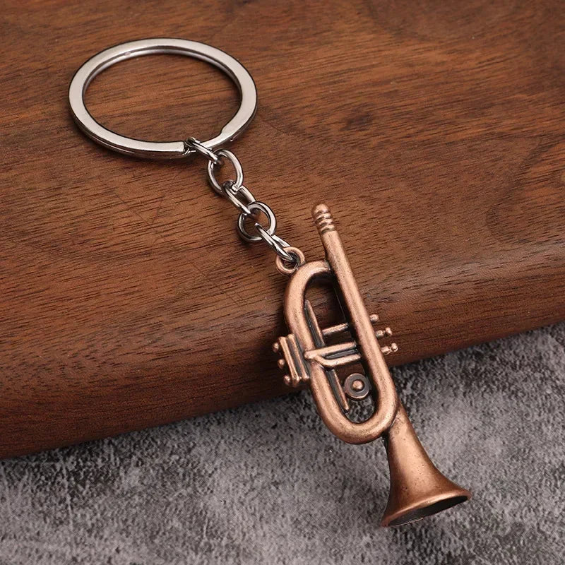 Bronze-colored miniature trumpet metal keychain pendant with silver ring and chain ideal for women keyrings mini gift men
