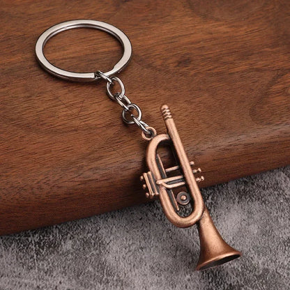 Bronze-colored miniature trumpet metal keychain pendant with silver ring and chain ideal for women keyrings mini gift men