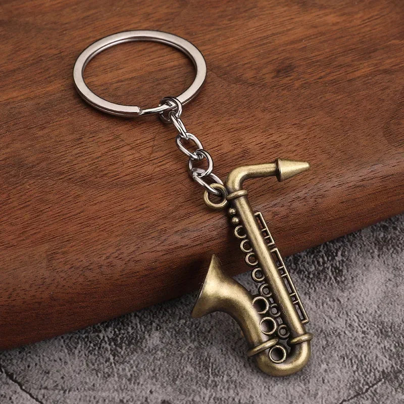 Antique brass saxophone keychain with detailed keys and silver-toned ring mini retro musical instrument women keyrings small gift men