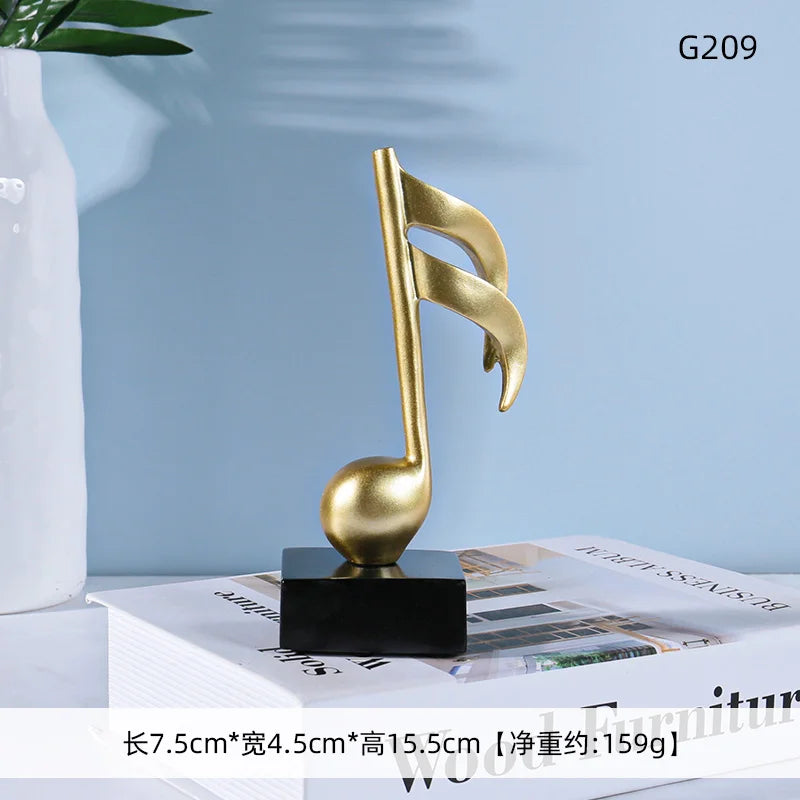 Golden musical note statue with sleek metallic finish on black base for music symbols resin crafts ornaments piano decor