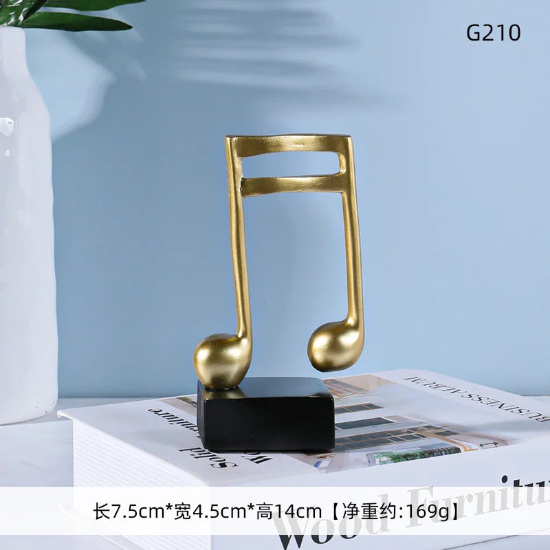 Gold-colored glossy musical note statue resin crafts ornaments piano with black base for office and room decoration
