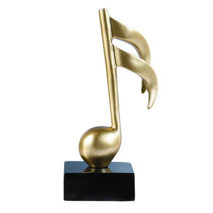 Golden musical note statue with sleek metallic finish mounted on black base for crafts ornaments piano decor