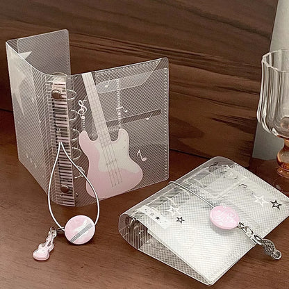 Clear plastic binder notebook scrapbook with pink white guitar design silver clasps and tie closure photo album card organizer
