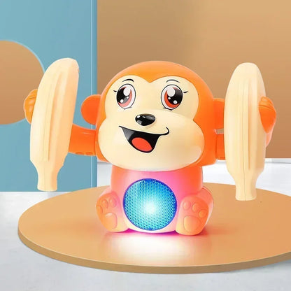 Orange and cream plastic musical crawling monkey toy with banana arms and glowing blue light belly for tummy time gifts