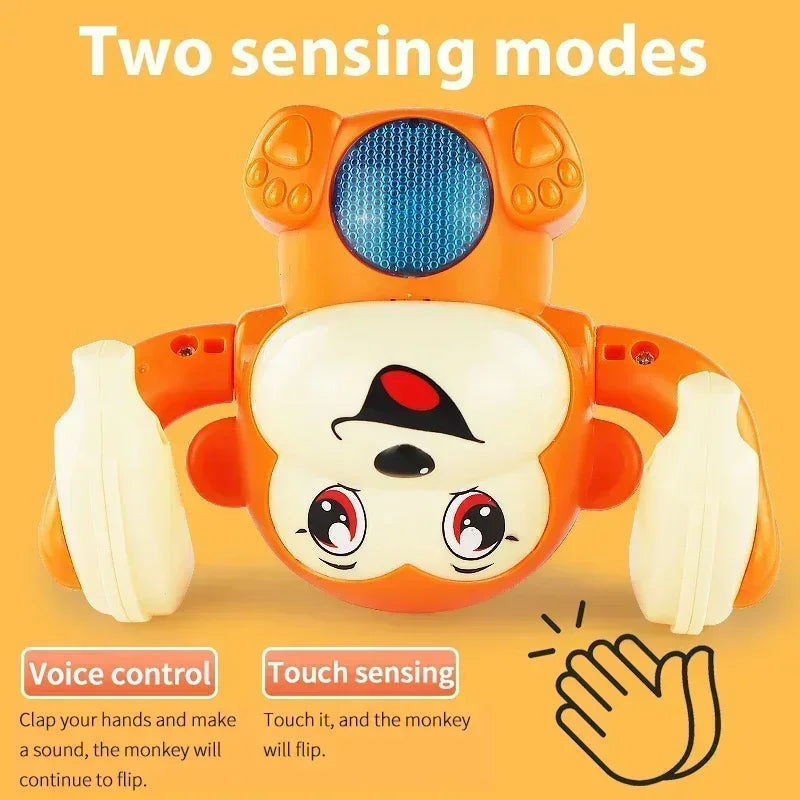 Orange and white plastic musical crawling monkey toy with blue textured head panel red eyes black hat for tummy time gifts