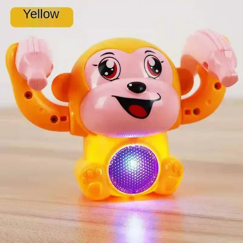 Yellow plastic musical crawling monkey toy with pink face and glowing purple belly light for tummy time gifts