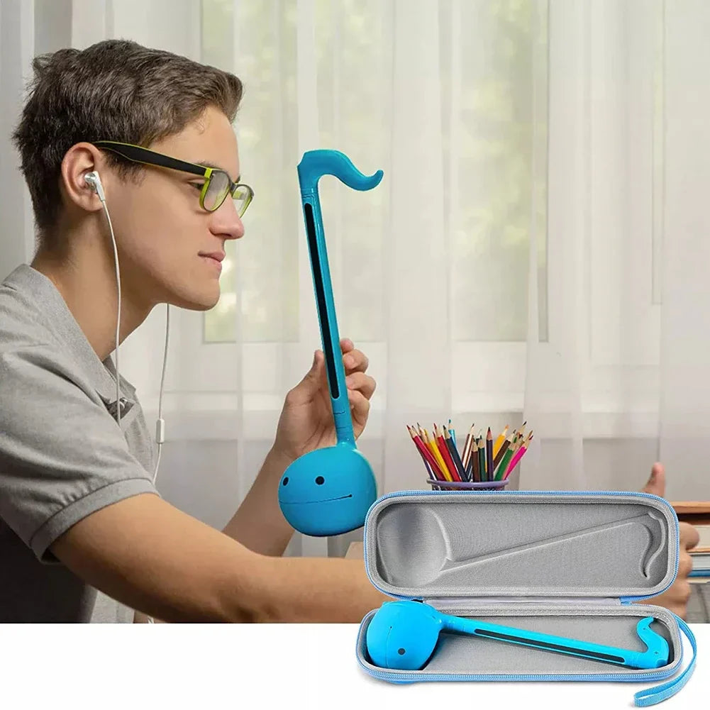 Blue plastic koto-style musical instrument with smiling face features waterproof music instrumental toy storage