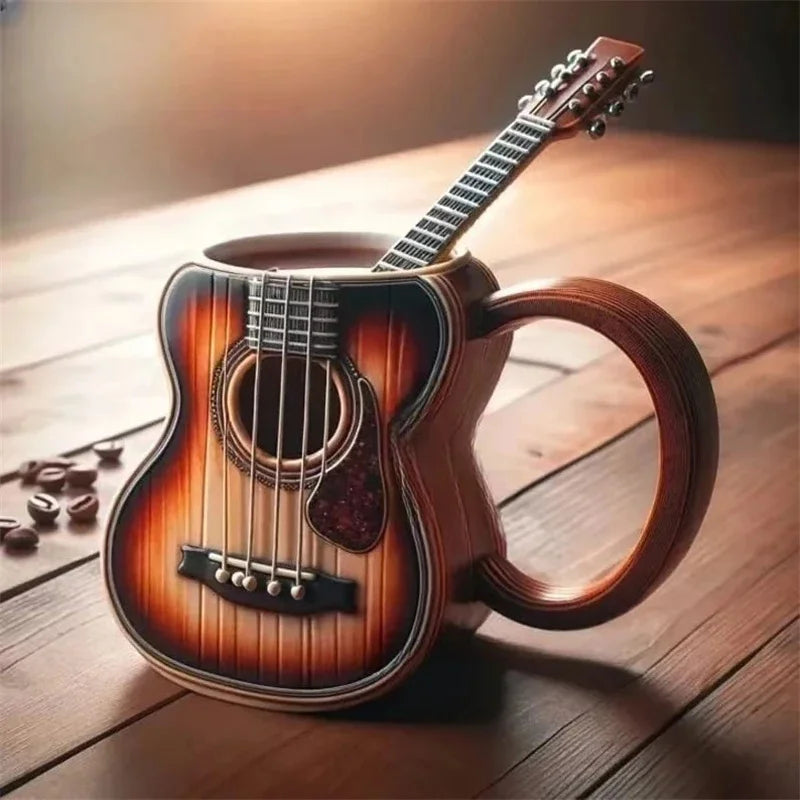 A ceramic acoustic guitar mug with sunburst finish and detailed strings perfect as a musicians birthday gift or office desk table decor