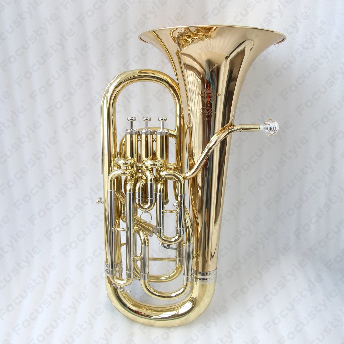 Shiny gold brass professional euphonium with intricate engraved bell and polished silver valves high quality instrument