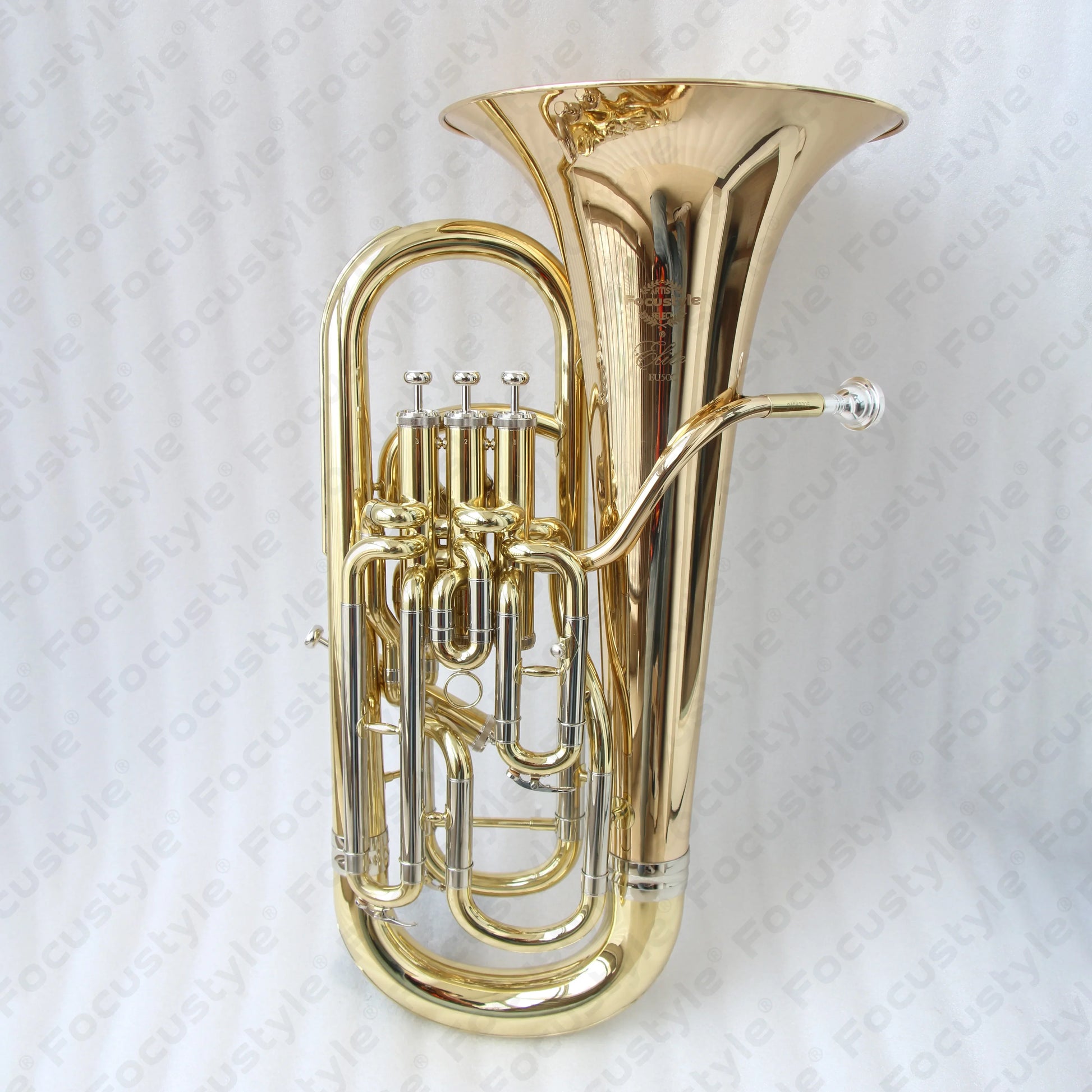 Shiny gold brass professional euphonium with intricate engraved bell and polished silver valves high quality instrument