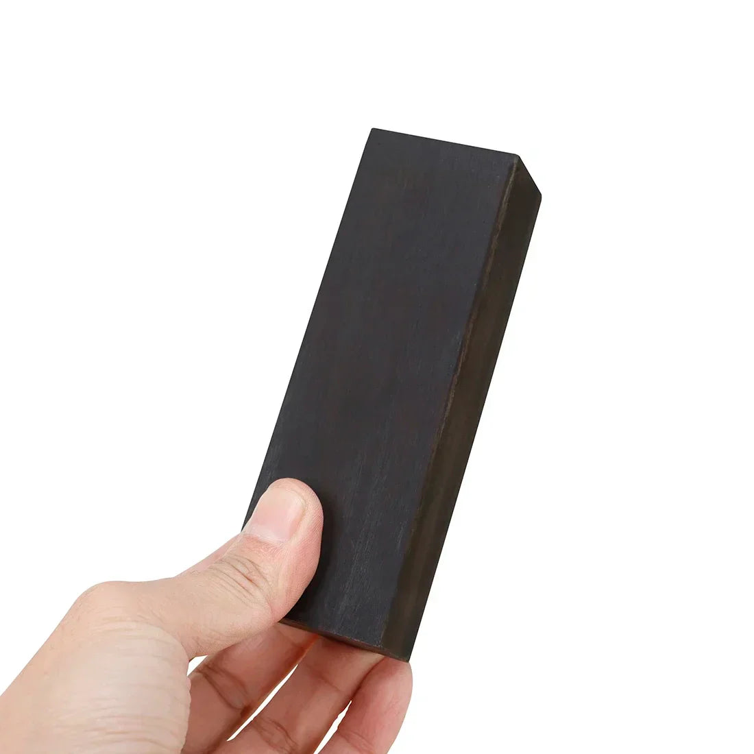 Black rectangular ebony diy musical instrument handle held in hand as craft material diy for handicraft tools