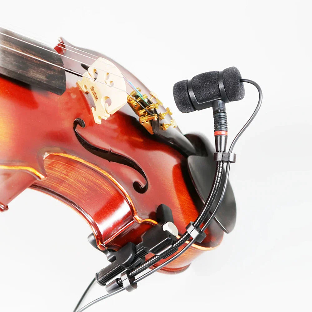 Black lavalier musical instrument microphone with foam windscreen and flexible clip attached to violin for violin mandolin cello use