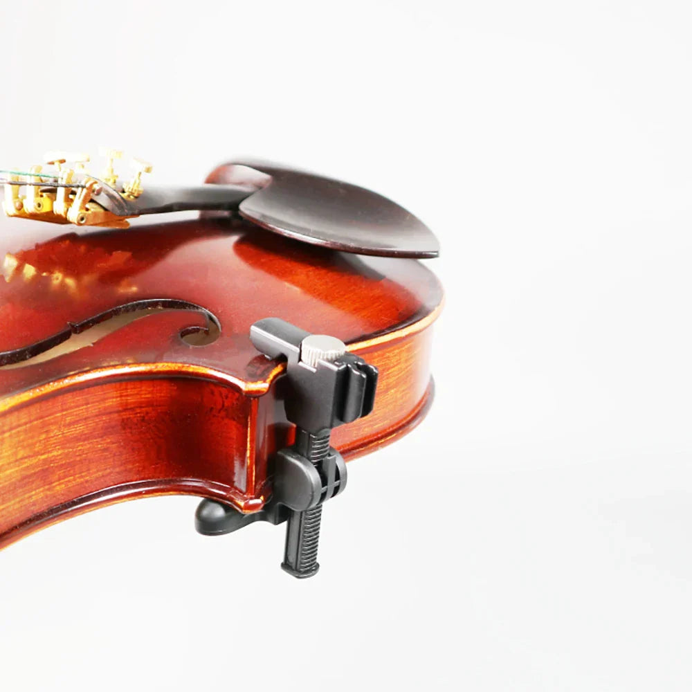 Black plastic musical instrument microphone clamp attached to reddish brown violin mandolin cello wooden body