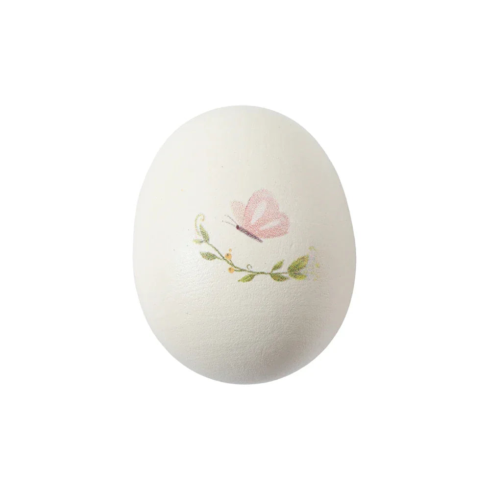 A delicate white egg with pink butterfly and green vine detailing in early educational wooden musical instruments montessori toys drum xylophone