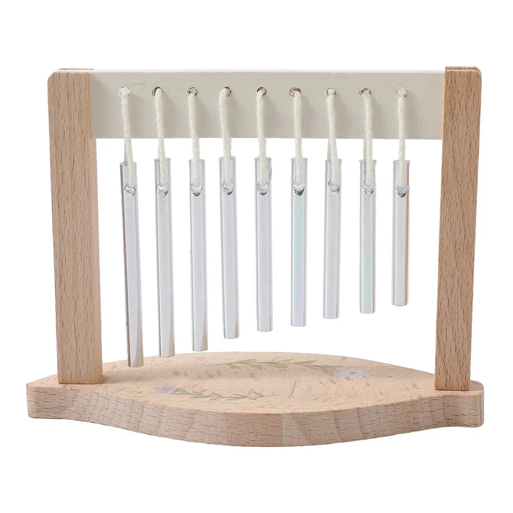 A wooden-framed musical instruments montessori chime set with eight clear glass tubes and floral decals on the base