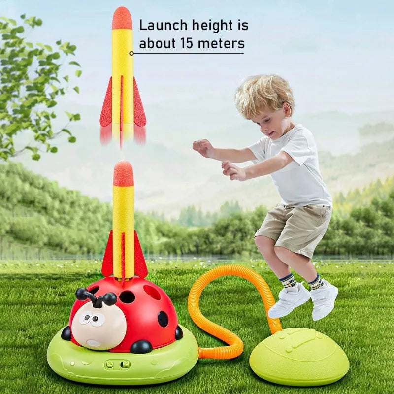 Red and yellow ladybug-shaped musical jump toss toy with orange launch tube for sports entertainment and three-in-one rope skipping