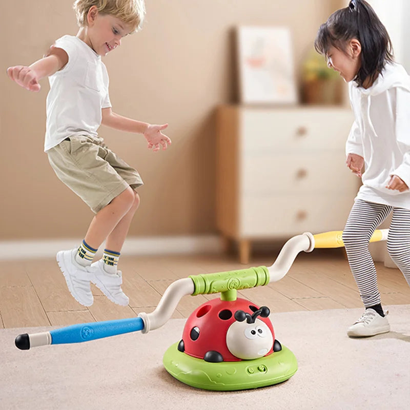 Red and green ladybug-shaped musical jump toss toy with blue handle for three-in-one rope skipping and sports entertainment ladybug