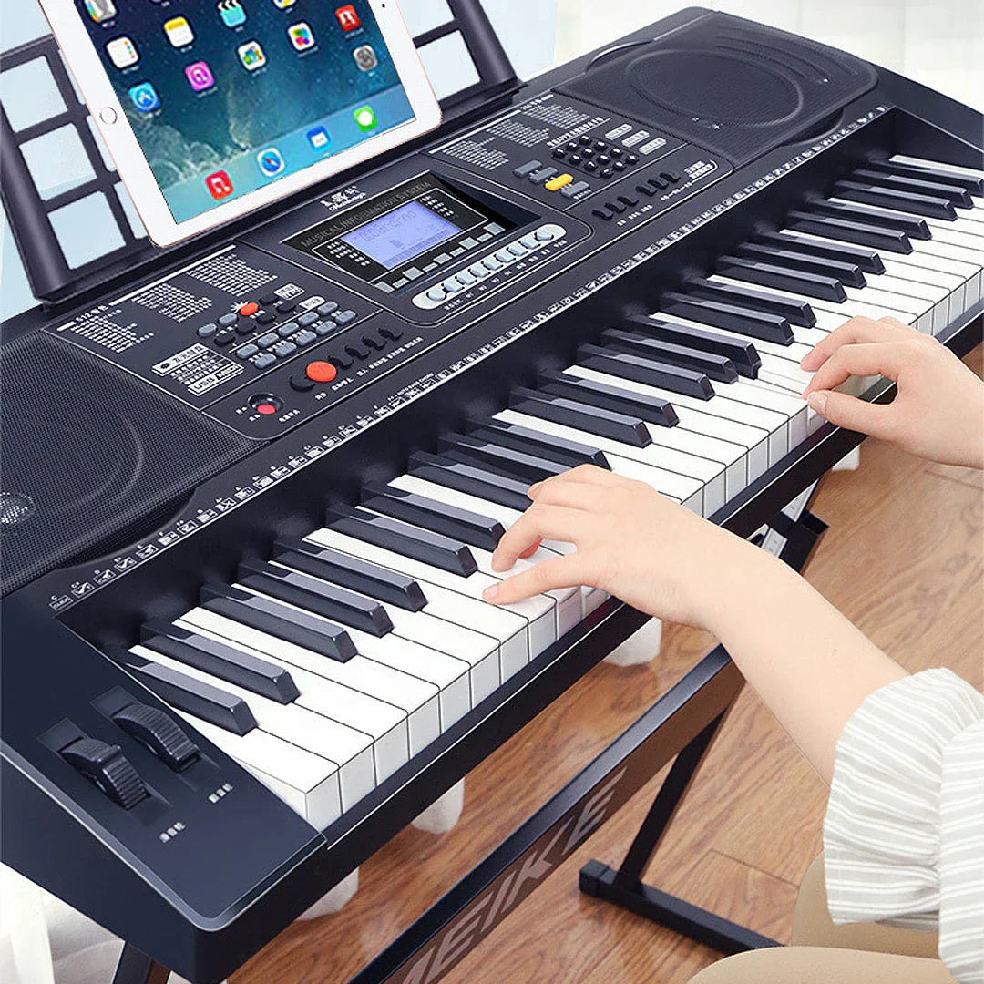 Black musical keyboard professional midi controller with 61 keys, control panel, speakers, and a mounted tablet stand